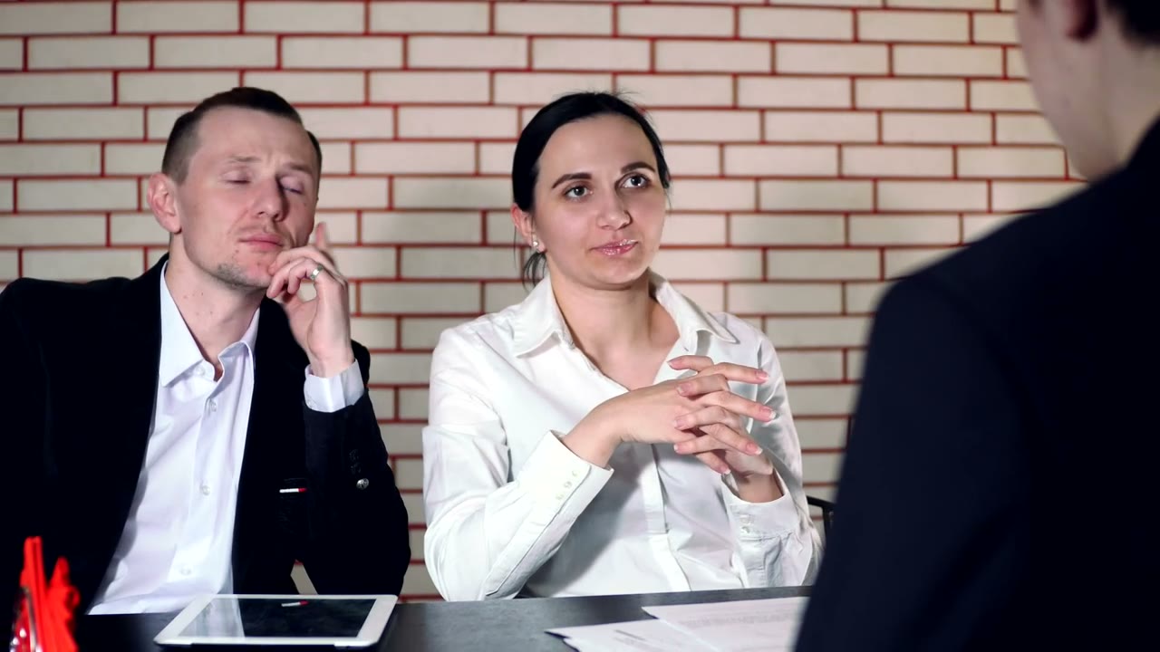 Interviewers discussing a role with a candidate